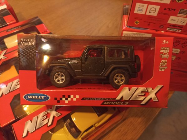 Метална количка Welly - 2007 Jeep Wrangler Rubicon 1:34 - Image 2